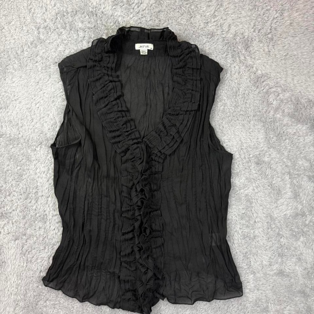 Black ruffled blouse with a flowy, boho vibe.